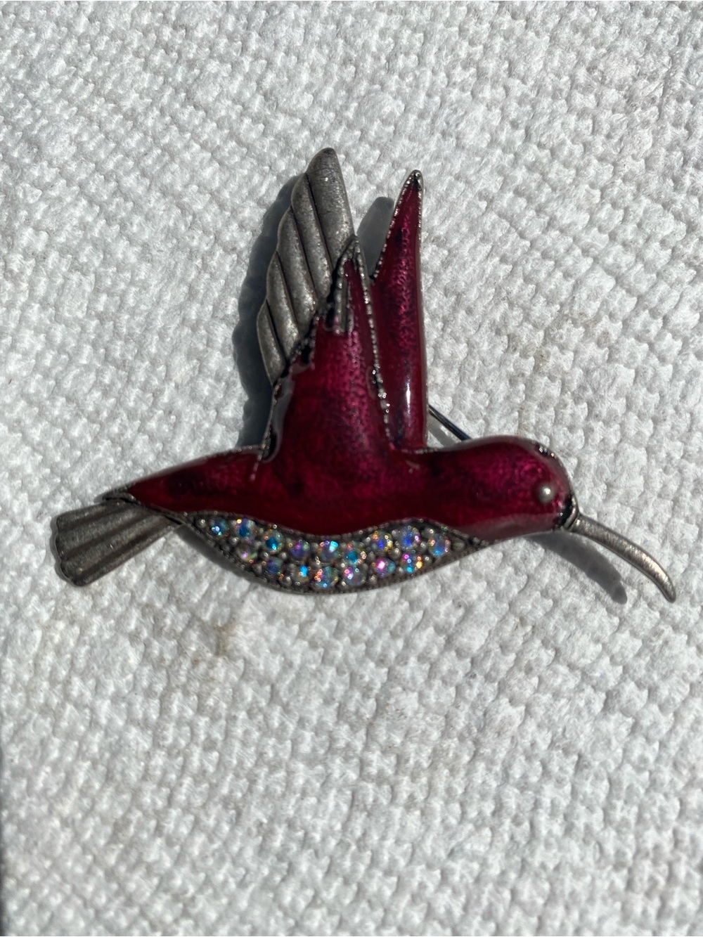 Vintage burgundy enamel, hummingbird. AB Rhinestone Silvertone pin.